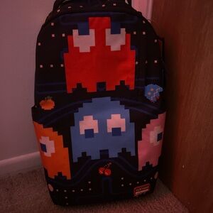Sprayground Black Backpack with Red, Blue, and Pink Design